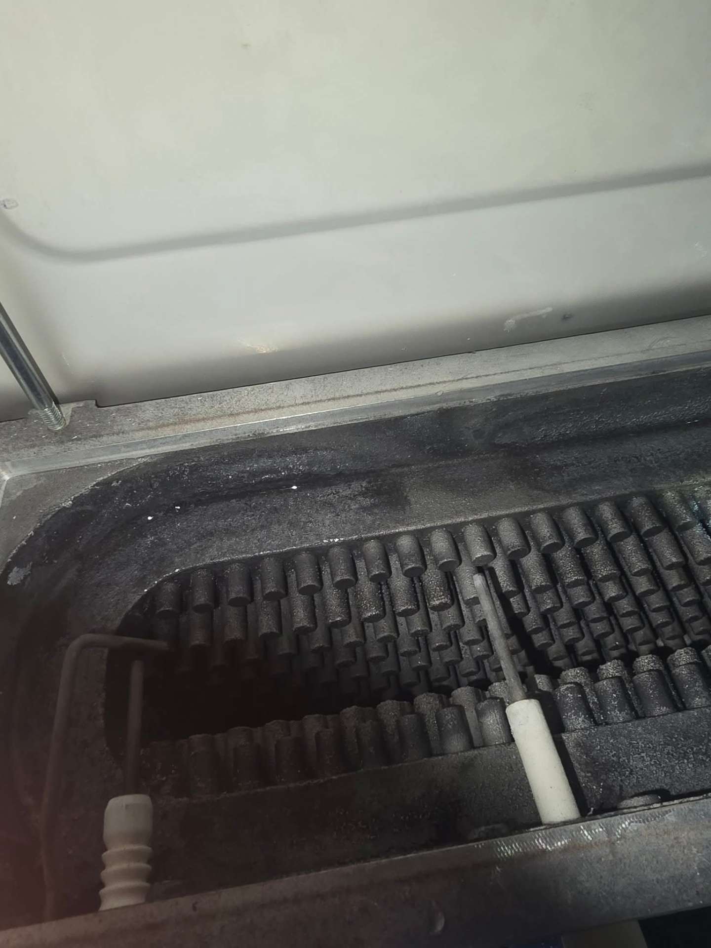 Cast iron heat exchanger fouled with soot before Gas Safe servicing